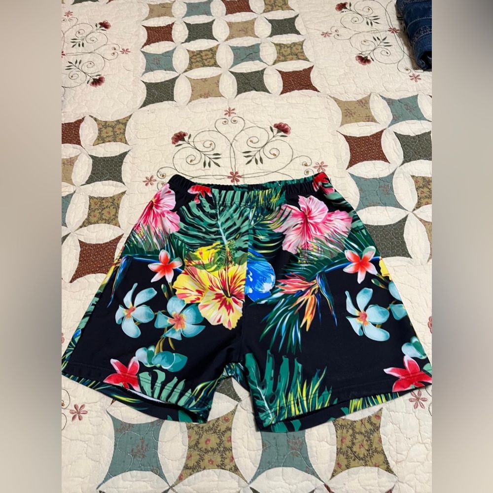 (2) Multicolored floral print swim trunks